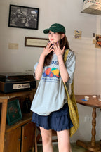 RAINY 여유로운 여름 느낌 과일 알파벳 프린트 티셔츠 25SA23174C